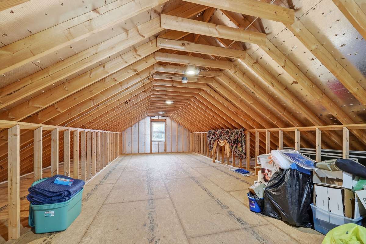 View of unfinished area upstairs over garage. Perfect area for play room, office or man cave