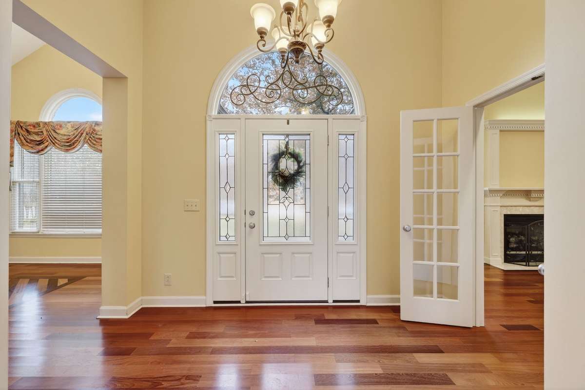 View of Grand entrance, reflecting the Brazilian Cherry Hardwood floors