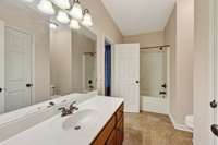 Full bath with a tub shower combination