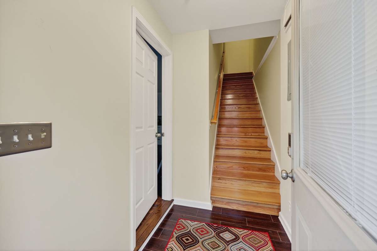 Hardwood steps from basement living area to up stairs living area