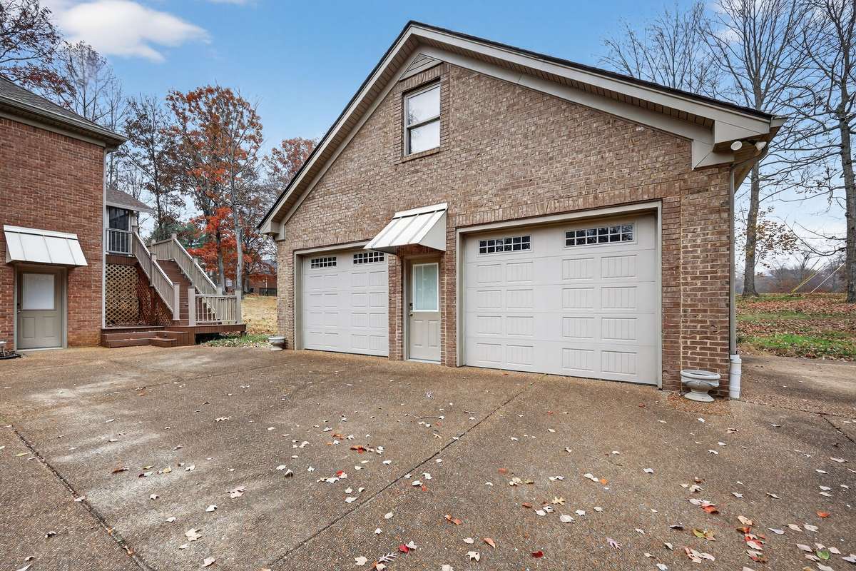 View of large 36x40 Garage that is heated and cooled with new HVAC.  Garage is completely finished with an upstairs that is framed out and ready for someone to finish.  Great Space for car enthusiast