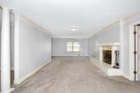 Living Room- carpet, gas log fireplace, crown molding