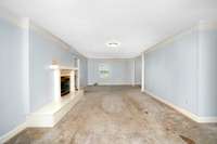 Living Room- carpet, gas log fireplace, crown molding