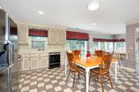 Kitchen- tile flooring, tile backsplash and countertops, crown molding
