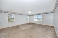 Bedroom- carpet, crown molding, ceiling fan