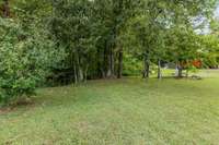 A babbling creek just beyond the rocked-in fire pit...