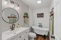 Beautiful shiplap and a soaking tub...