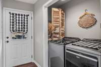 Extra large capacity dryer and extra larger capacity washer with removable agitator conveys...