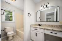Hall bath (full bath with shower tub combo, vanity offers new granite countertop/re-faced cabinety, new lighting.