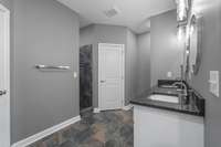 Awesome primary bathroom with double vanities, large walk in shower, 2 separate closets!