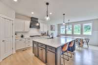 Huge chef's kitchen with oversized island with extra storage