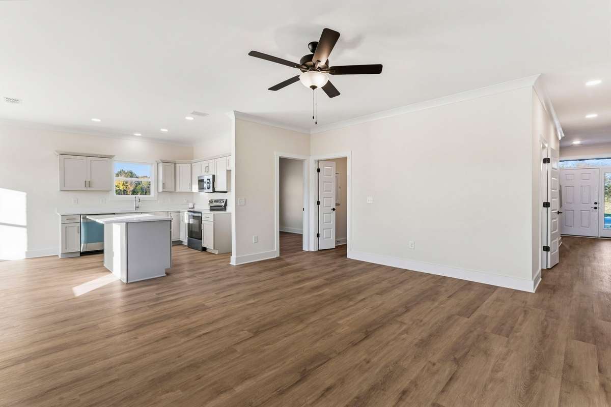 From the living room you have a great vantage point of the front door, garage entrance and kitchen!