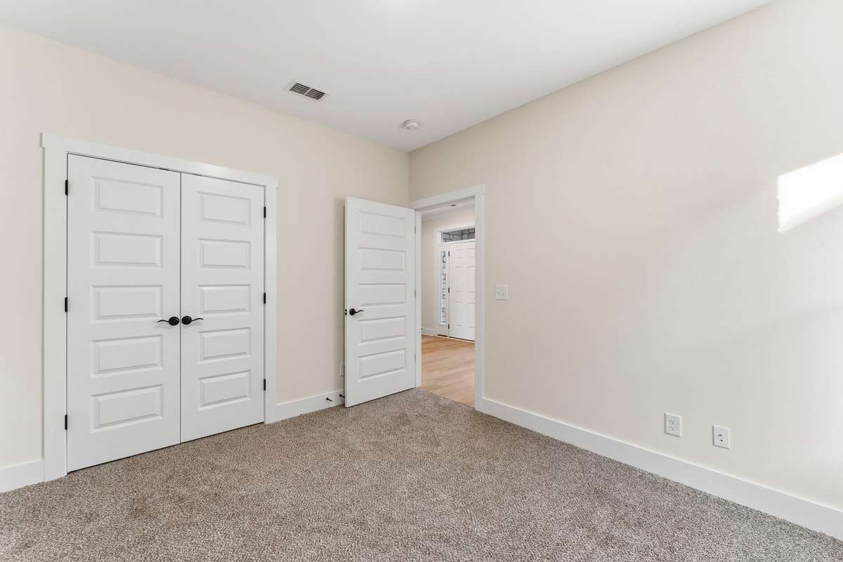 From the inner bedroom, you can see the natural light flowing from the front door's transom windows!
