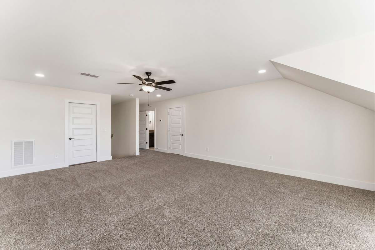 From the bonus room, there are 2 attic access doors for extra storage.