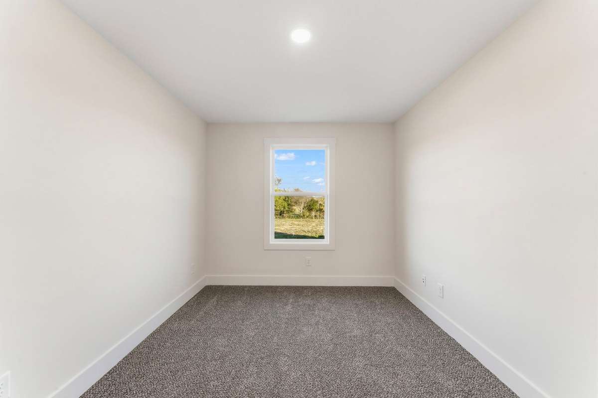 The upstairs office has a view of the front yard and makes for a great second-office!
