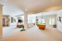 The generous square footage also provides ample room for a pool table, making this lower level an ideal recreational retreat for family and friends. Note the putting green!