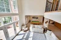 The sunny living space has walk-out access to the newly hardscape patio and outdoor living areas.