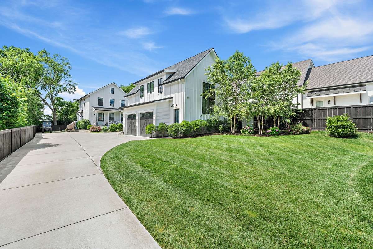 The detached, generously-sized garage easily stores two cars with remaining space for a golf cart or a third smaller vehicle. Room for a workshop and a home gym as well.