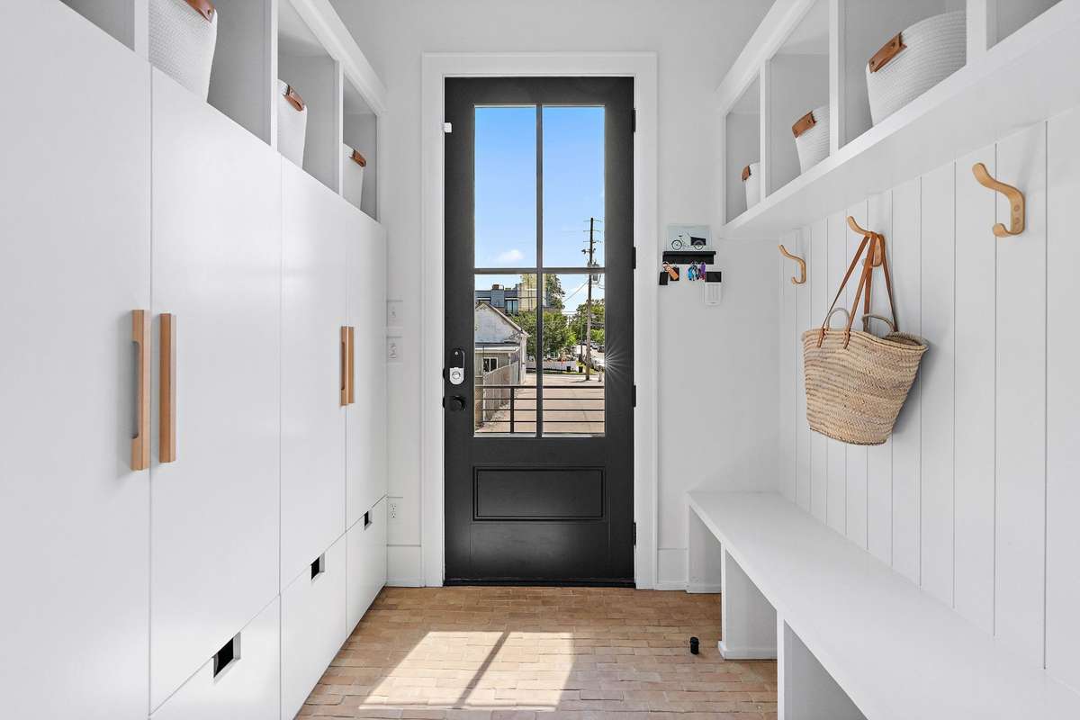 Mudroom Drop Zone has thoughtful cabinetry to store all of life's daily necessities.