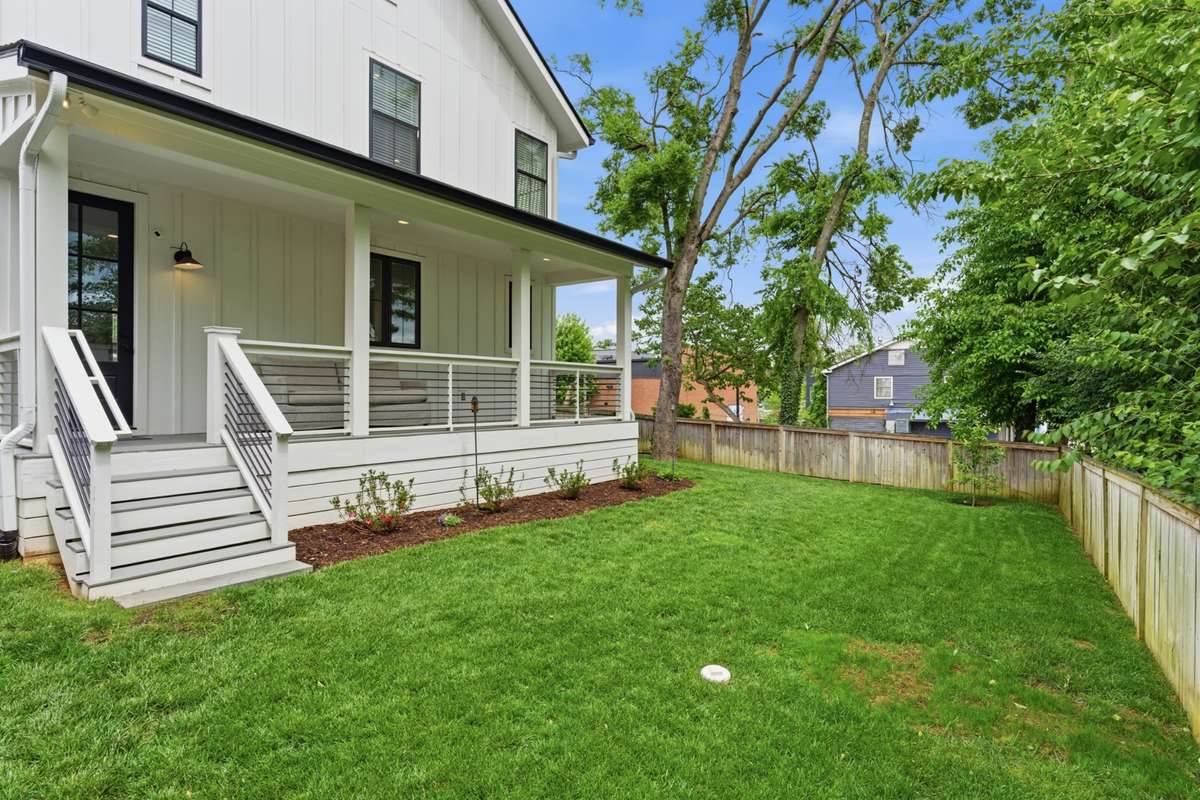 Covered Back Deck overlooks the fully fenced backyard.