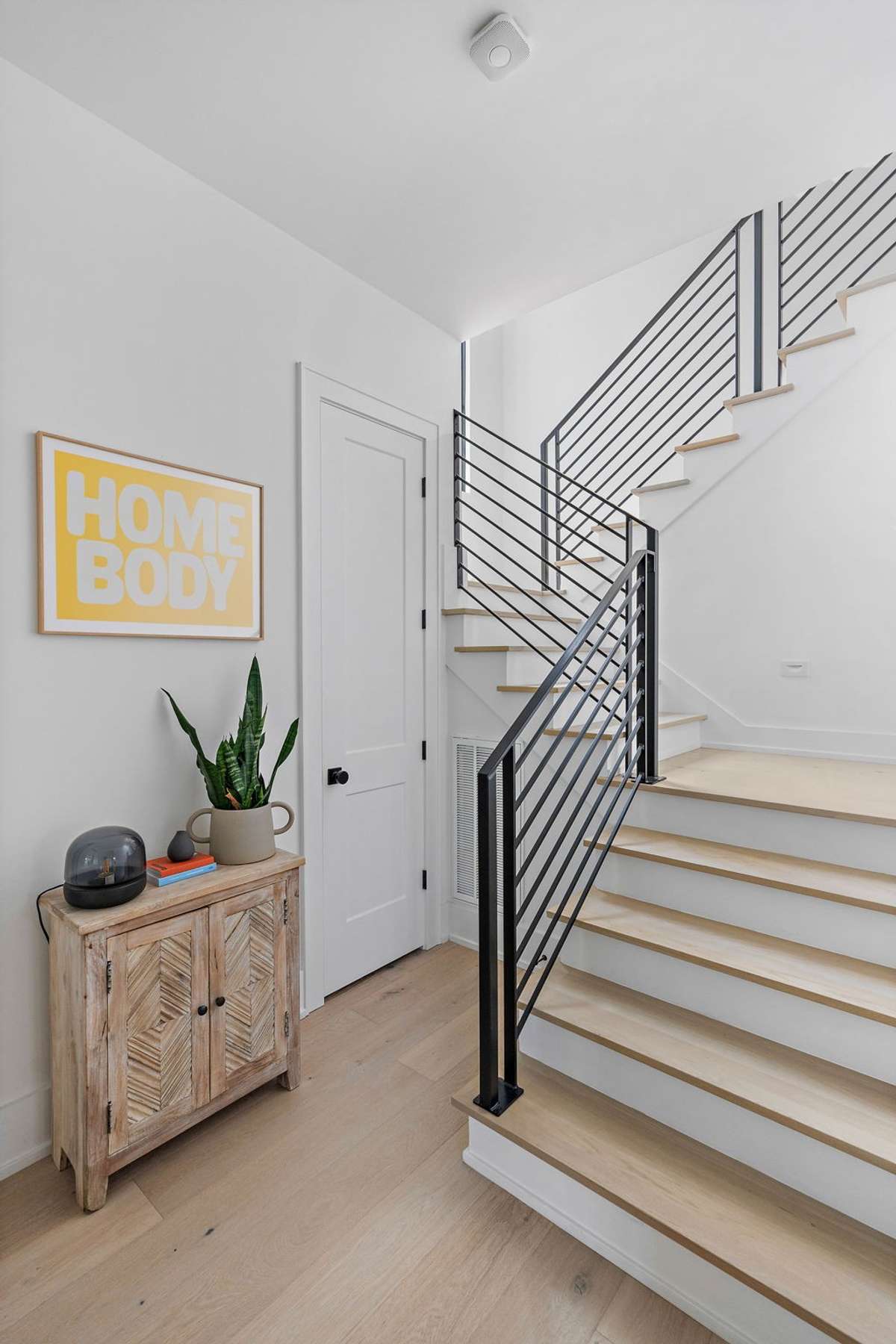Coat closet + stairs leading to second story.