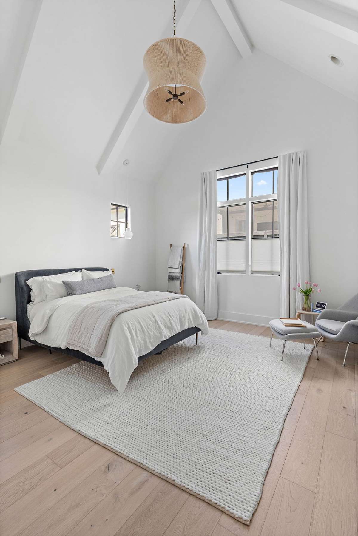 Soaring ceilings tastefully accentuated with beams with windows overlooking the backyard.