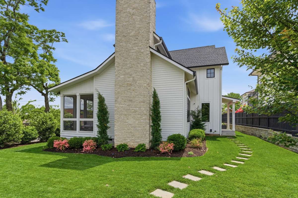 Stone path leads you to the covered front porch.