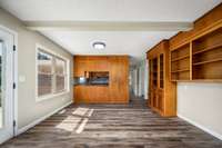 Breakfast area located off of the kitchen with built-in cabinets and shelves.