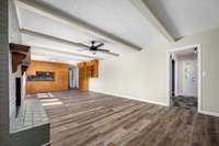 View from the den to the front foyer. Neutral colors throughout the home.