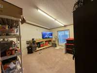 This is the 3rd bedroom currently being used as workspace