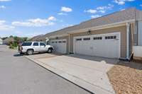 Two car garage with two open spaces, plus guest parking across the street from the front of the home!