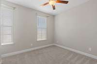 Third bedroom with two windows for additional sunlight, ceiling fan in each bedroom, large closet.