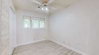 Bedroom 2. New flooring. Great views to the backyard.