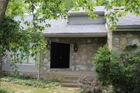 Inviting double doors and a covered porch entry welcome you and guest to this exceptional home.