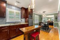 Double stainless sink and window overlooking the front yard.  The carpenter's bench used as the island does not remain.