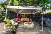 This patio just outside of the sunroom is to the left of the house behind the privacy fence with a gate to the front yard. Very private area for entertaining or just enjoying the outdoors.