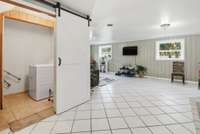 Laundry room behind the barn door.