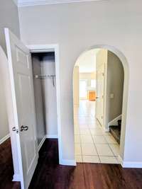 Hall closet and hallway to Kitchen and dining