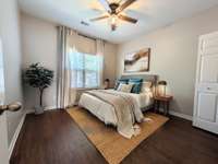 Virtually staged (Chat GPT) front bedroom on first floor