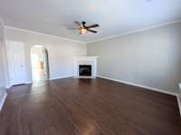 Large Great Room with gas burning fireplace. New paint throughout entire unit, including ceilings and trim