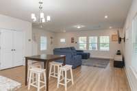 The open dining area flows seamlessly into the kitchen. A walk-in pantry provides plenty of storage, making both everyday living and entertaining a breeze.