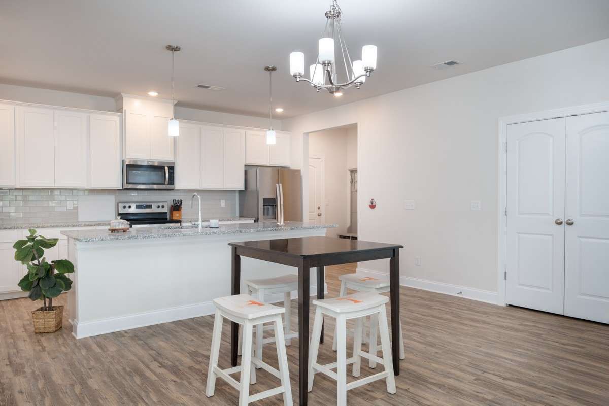 Large dining area that will accommodate a full-size table.