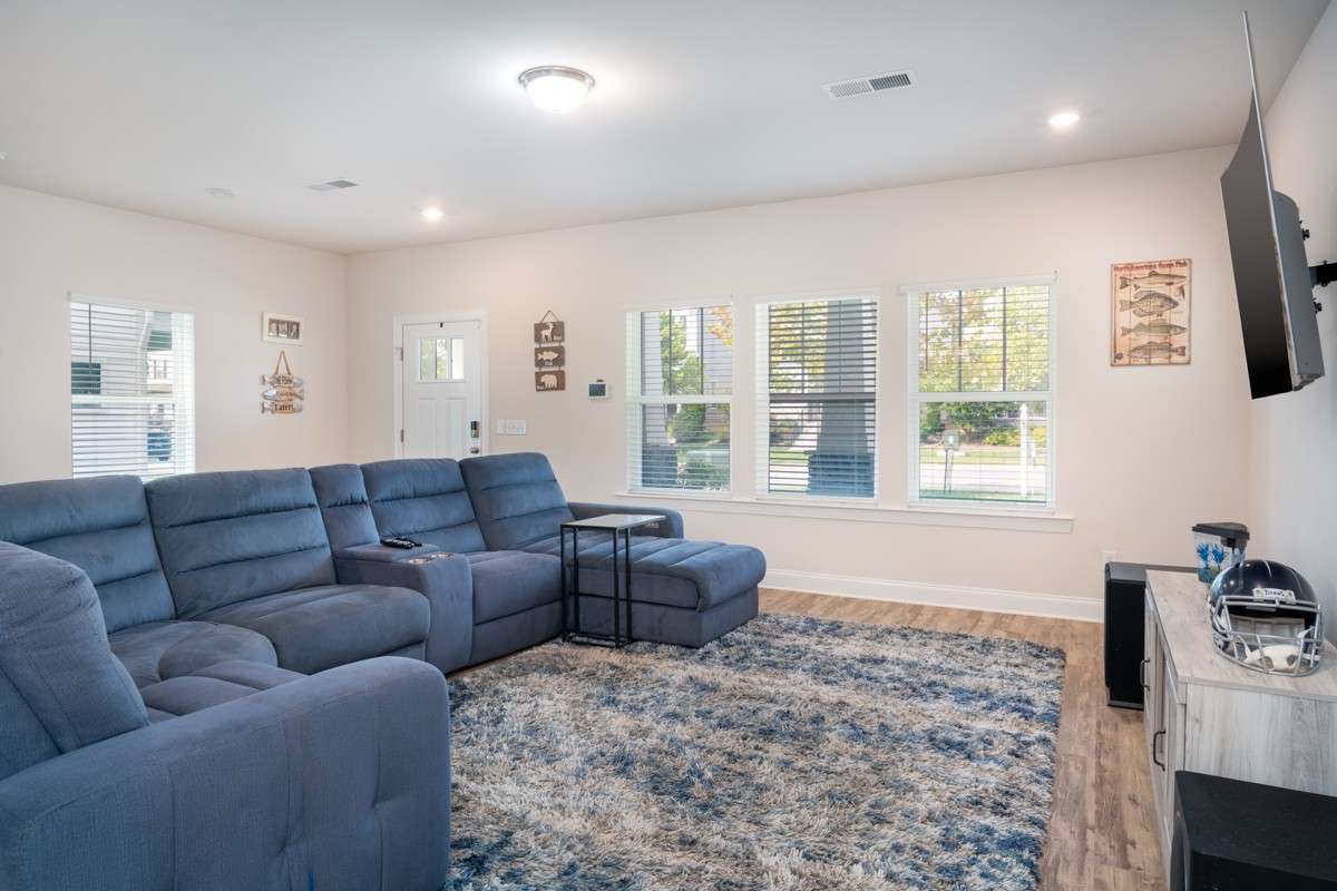 The spacious living area is perfect for entertaining, relaxing, or family movie nights.