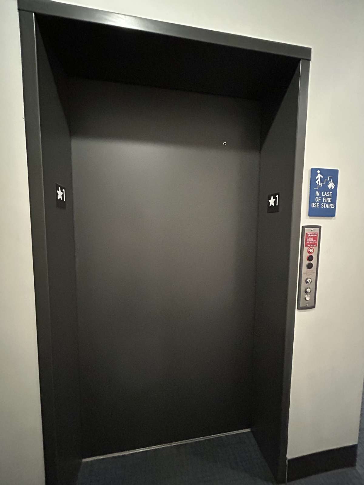The elevator to the second and third floors is just across the hall from this unit.
