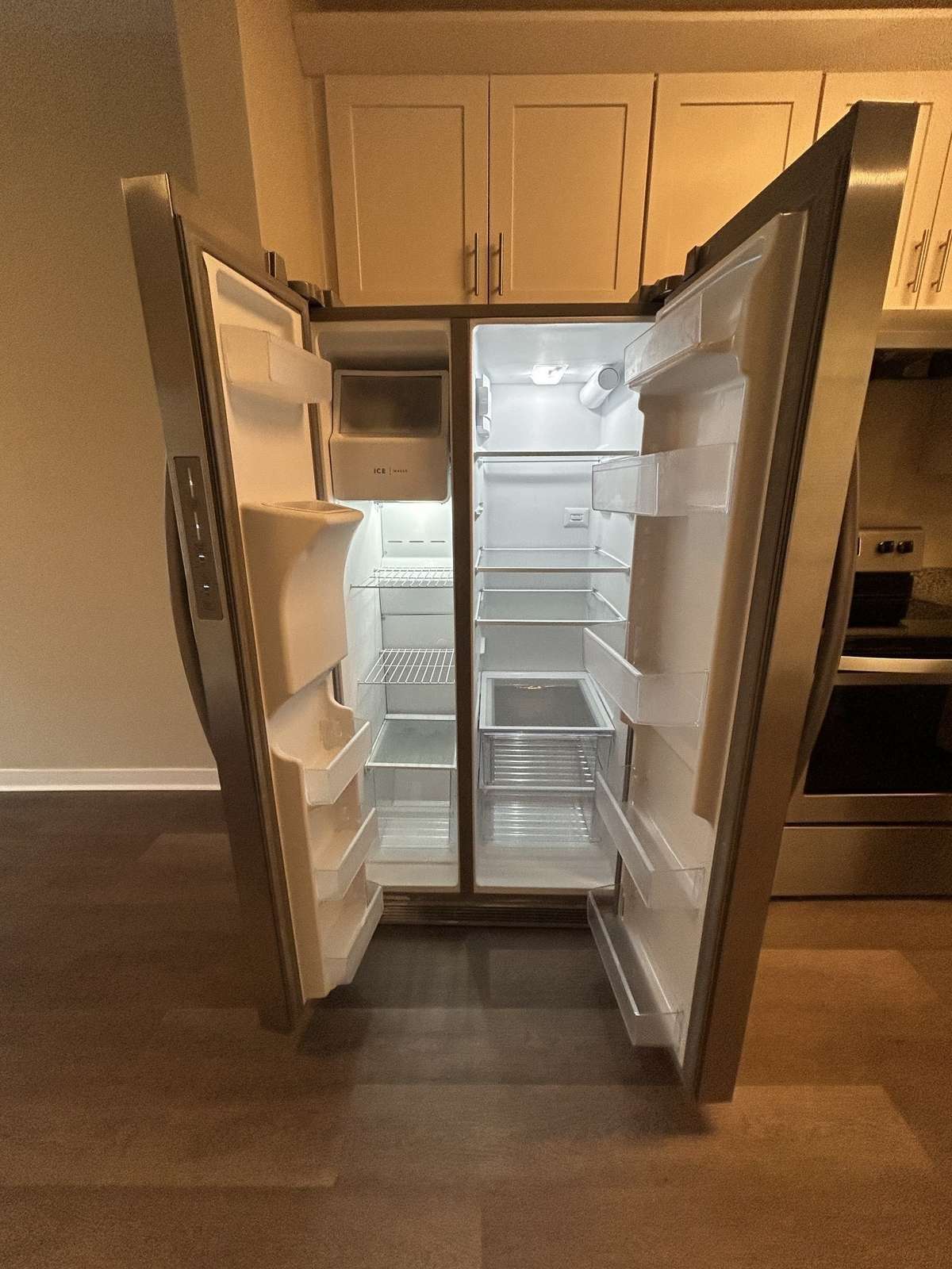 Lots of space with shelves in the door, and vegetable bins in the bottom.