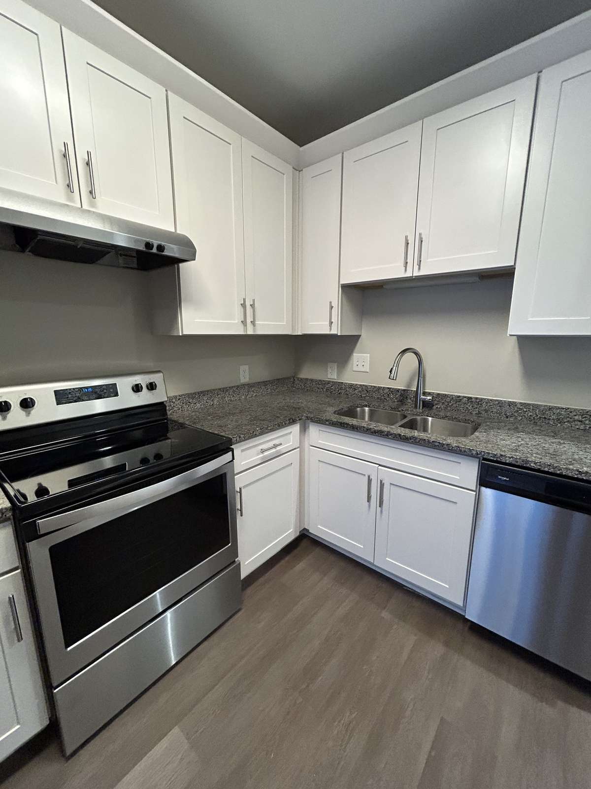 Smooth-top range, single oven, and storage drawer for larger cookie sheets or broiler pans. Vent above the cooktop.