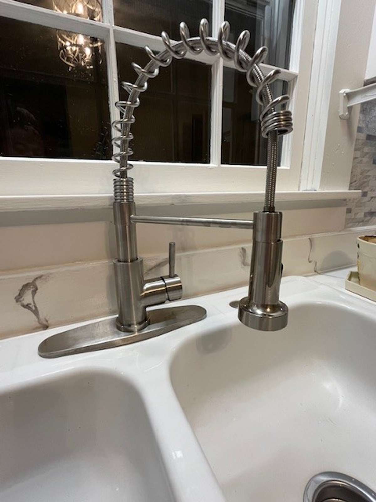 Beautiful farmhouse faucet with the original cast iron sink.