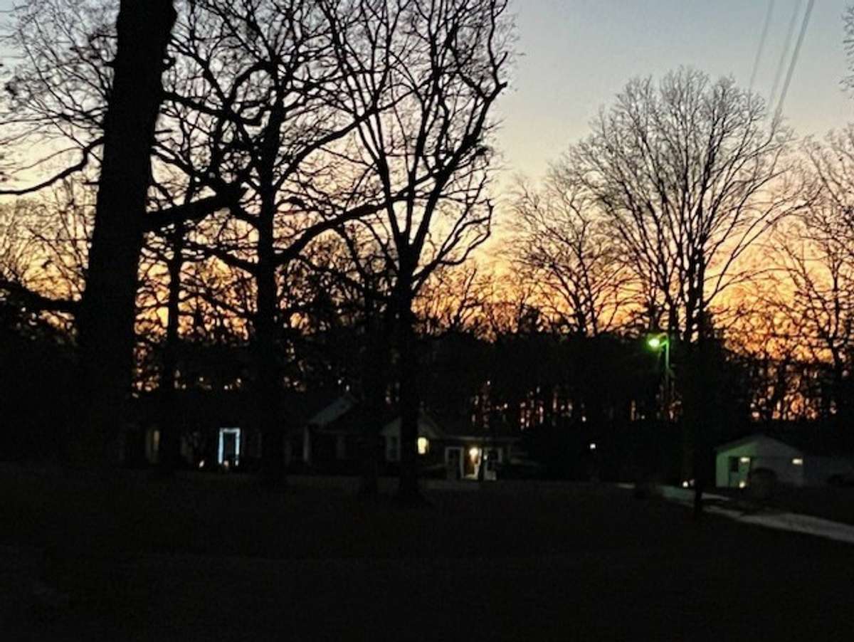 Beautiful sunset behind the home.