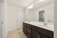 Double Vanity and linen closet in one space between bedroom 3 and 4. Then shower and toilet in separate room.