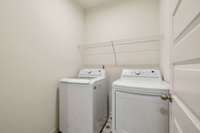 Laundry Room complete with Washer and Dryer.